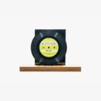 Vinyl record on a wooden stand with a black sleeve, label reads Altin Gun — B side titled 'Way Way' (yellow label)