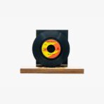 2301450012A | 3345 Records Vinyl record mounted on a black square pedestal with a wooden base, label orange and yellow at center.