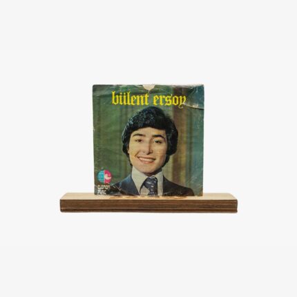2301450036A | 3345 Records Album cover with a smiling portrait of a person in a suit; bold yellow text says 'Bülent Ersoy' across the top on a green background.