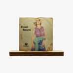 2301450078B | 3345 Records Vintage album cover: Emel Sayin in a purple lace top with a green sash, worn backdrop, on a wooden stand.