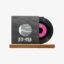 Vinyl record partially pulled from a dark sleeve labeled 33:45, resting on a wooden base against a light background.